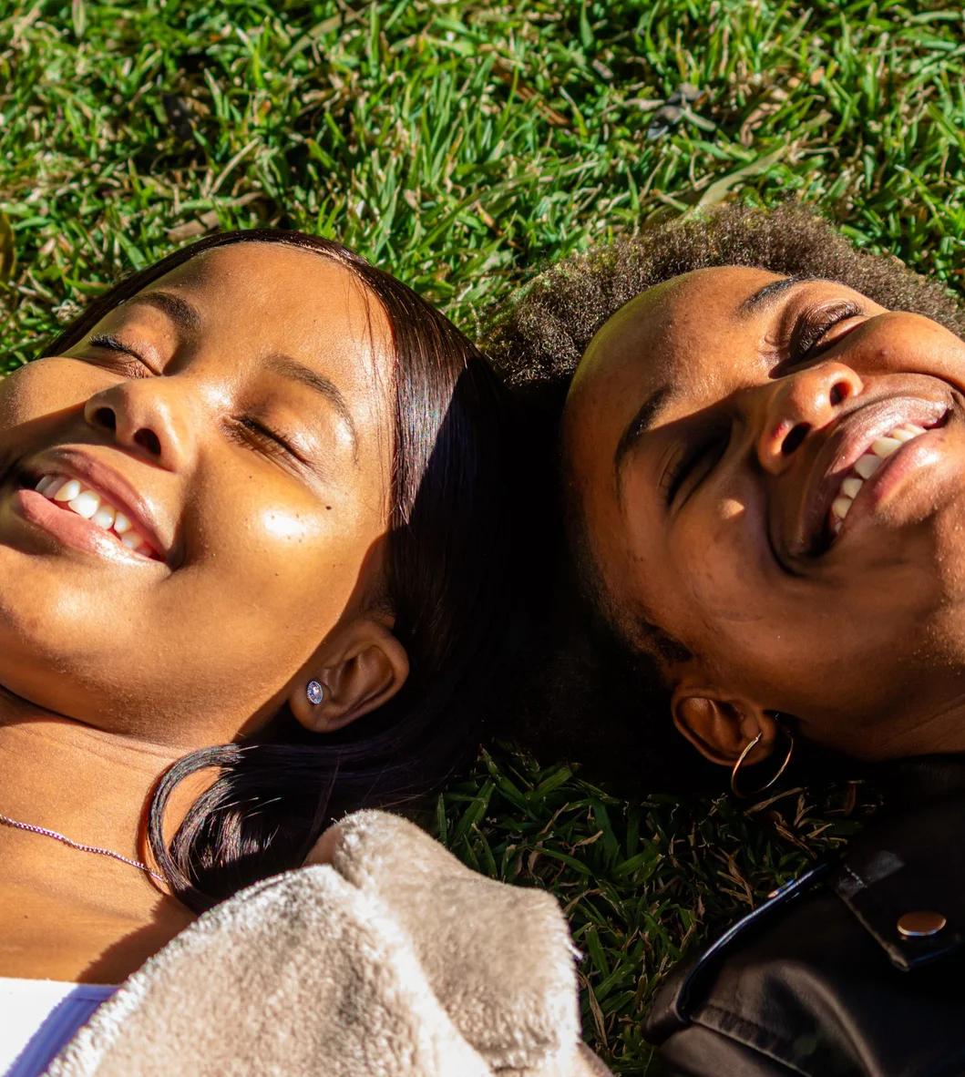 Two friends laughing together